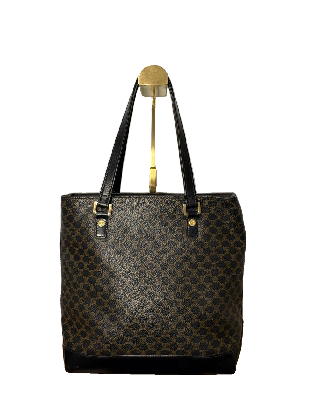 Celine tote Macadam con asas negras largas y estampado marrón, vista frontal sobre fondo blanco